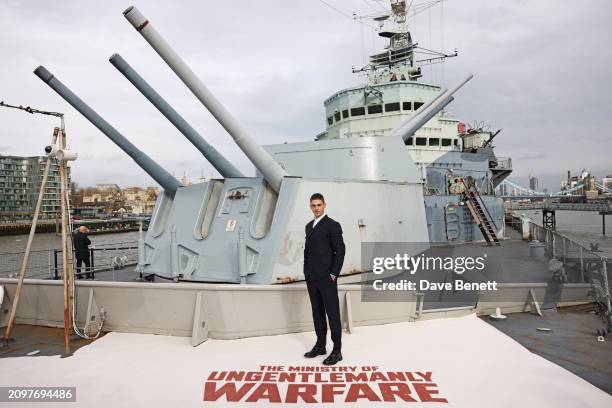 Hero Fiennes-Tiffin attends the London photocall for "The Ministry Of Ungentlemanly Warfare" at HMS Belfast on March 22, 2024 in London, England.