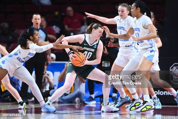 Julia Ayrault of the Michigan State Spartans gets surrounded by North Carolina Tar Heels during the First Four round of the 2024 NCAA Women's...