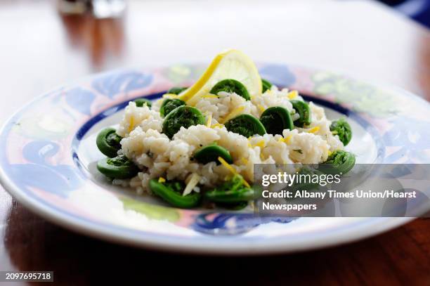 View of a dish of lemon zest risotto with fiddlehead ferns, photographed at Villago Pizzeria & Ristorante on Thursday, May 15 in Ballston Lake, N.Y.