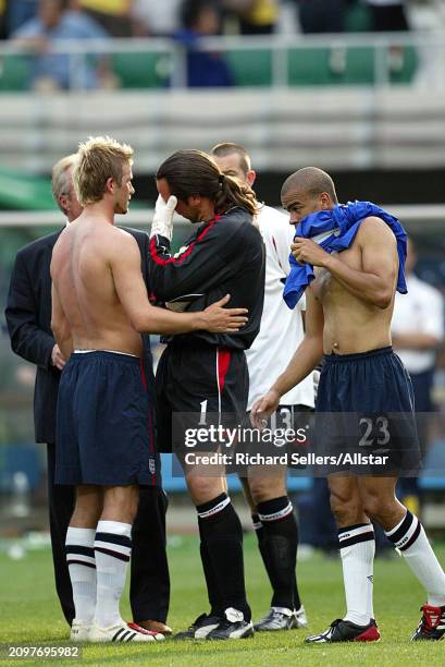 David Beckham of England and David Seaman of England look dejected after the FIFA World Cup Finals 2002 Quarter Final match between England and...