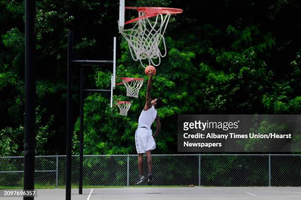 Devon Jordan of Schenectady practices his basketball skills at Central Park on Monday, July 14 in Schenectady, N.Y. Jordan moved to the area from...