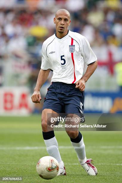 Rio Ferdinand of England on the ball during the FIFA World Cup Finals 2002 Quarter Final match between England and Brazil at Shizuoka Stadium Ecopa...