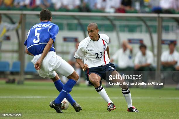 Kieron Dyer of England and Edmilson of Brazil challenge during the FIFA World Cup Finals 2002 Quarter Final match between England and Brazil at...