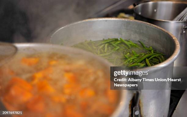 Yams and string beans are cooked as staff and volunteers prepared lunch at Capital City Rescue Mission on Monday, Dec. 29 in Albany, N.Y....