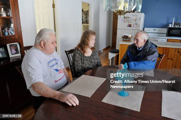 Peter Sajta, left, and his wife, Joanne Sajta talk with Paul DuBois, with Mountains to Miracles Veteran's Foundation at their home on Thursday, Jan....