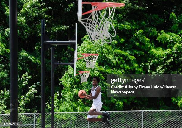 Feature Photo Devon Jordan of Schenectady practices his basketball skills at Central Park on Monday, July 14 in Schenectady, N.Y. Jordan moved to the...