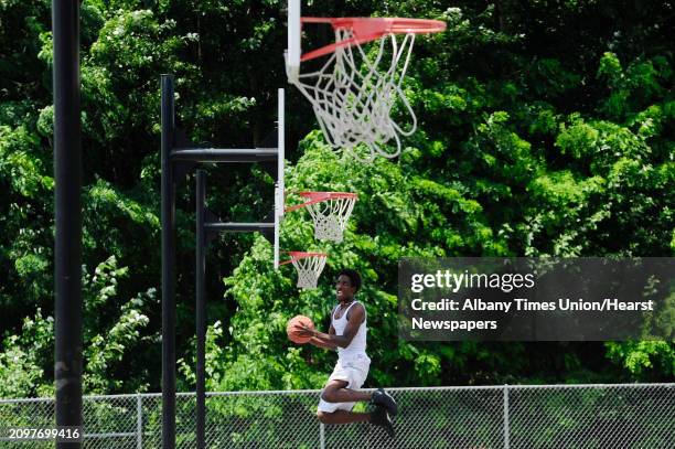 Devon Jordan of Schenectady practices his basketball skills at Central Park on Monday, July 14 in Schenectady, N.Y. Jordan moved to the area from...