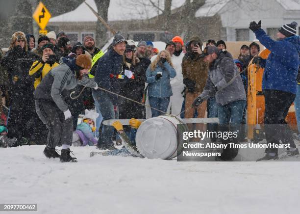Team crashes early in the race on Lake Desolation during the annual Outhouse Races at Tinney's Tavern on Sunday, Jan. 27 in Middle Grove, N.Y.