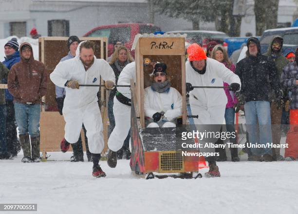 Drive Alli Schweizer with team PotRod yells for her teammates to go as they start the race on Lake Desolation during the annual Outhouse Races at...