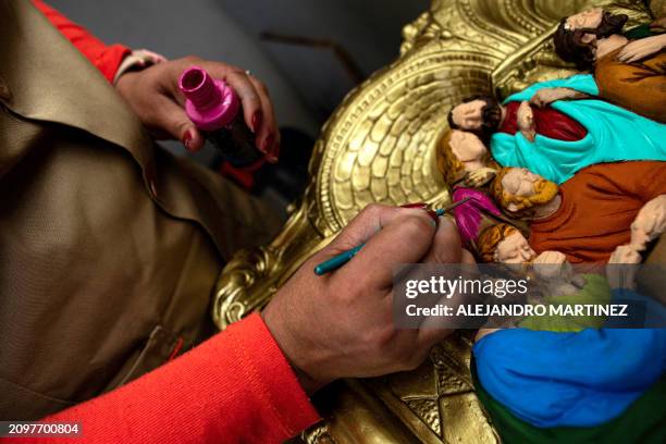 Ana Milena Tabares, convicted for production and drug trafficking charges, paints a handcraft at El Buen Pastor women's prision, in Bogota on...