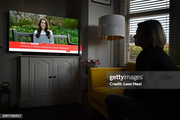 Relative of the photographer watches television, as Catherine, The Princess of Wales announces that she is receiving a preventative course of...