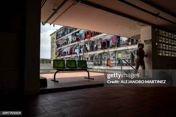 An inmate walks at El Buen Pastor women's prison, in Bogota on February 26, 2024. The Colombian Ministry of Justice estimates that 37% of the 7,000...