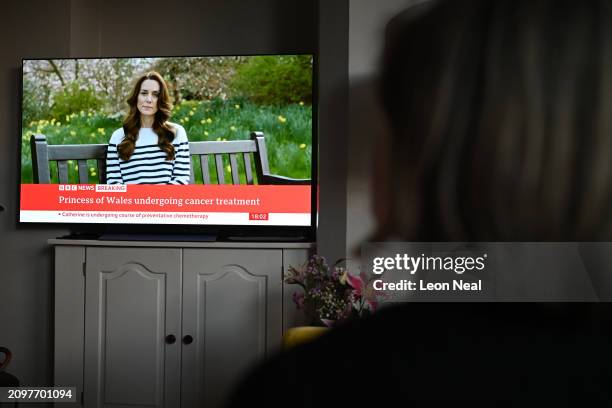 Relative of the photographer watches television, as Catherine, The Princess of Wales announces that she is receiving a preventative course of...