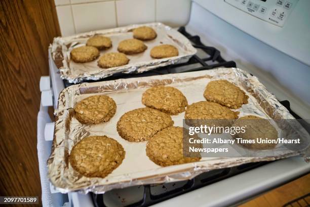 Gluten free brown sugar oatmeal cookies are seen on trays after being removed from the oven on Monday, April 1 in Albany, N.Y.