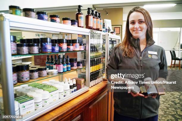 Erika Fallon, supervising pharmacist at Fallon Wellness Pharmacy, holds items that contain CBD at Fallon Wellness Pharmacy on Thursday, May 9 in...