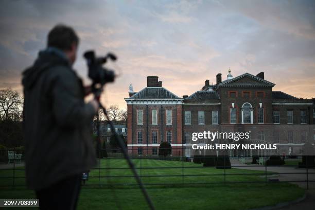 Camera operator films footage outside Kensington Palace in London on March 22, 2024. Britain's Catherine, Princess of Wales, announced that she has...