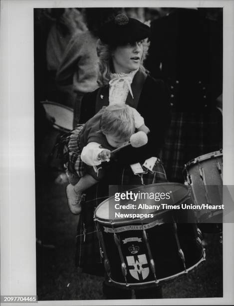 Scottish Games, New York - Lorraine Parker with her infant brother, Ian, age 1. She is with the Hatboro, Pennsylvania Ulster Scottish Pipe Band....