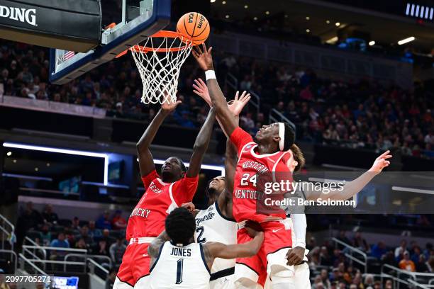 Tyrone Marshall Jr. #24 of the Western Kentucky Hilltoppers shoots the ball against the Marquette Golden Eagles during the first round of the 2024...