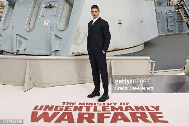 Hero Fiennes-Tiffin attends the London photocall for "The Ministry Of Ungentlemanly Warfare" at HMS Belfast on March 22, 2024 in London, England.