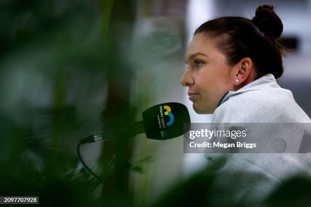 Simona Halep of Romania speaks to the media after a 6-1, 4-6, 3-6 loss to Paula Bados at the Miami Open at Hard Rock Stadium on March 19, 2024 in...