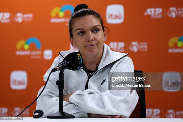 Simona Halep of Romania speaks to the media after a 6-1, 4-6, 3-6 loss to Paula Bados at the Miami Open at Hard Rock Stadium on March 19, 2024 in...