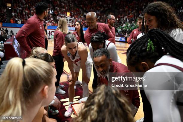 Head coach Kenny Brooks of the Virginia Tech Hokies speaks to his team in the first quarter against the Marshall Thundering Herd during the first...