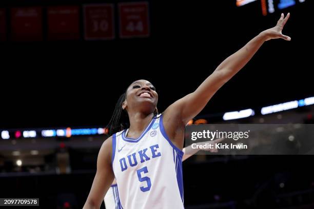 Oluchi Okananwa of the Duke Blue Devils waves to fans while walking off of the court after the NCAA Women's Basketball Tournament First Round game...
