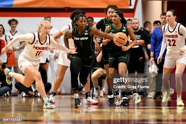 Mays of the Marshall Thundering Herd breaks down court in the first quarter as Matilda Ekh of the Virginia Tech Hokies tries to defend during the...