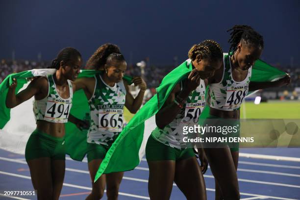 Nigerian team celebrates winning the Women's 4X4000m relay final of the 13th African Games in Accra, on March 22, 2024.