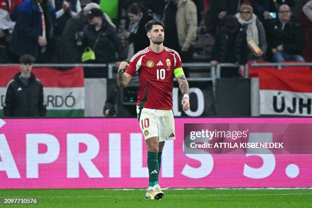 Hungary's forward Dominik Szoboszlai celebrates scoring the opening goal from the penalty spot during the friendly football match between Hungary and...