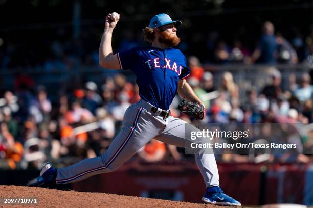 Zak Kent of the Texas Rangers pitches during a spring training game against the San Francisco Giants at Scottsdale Stadium on March 1, 2024 in...