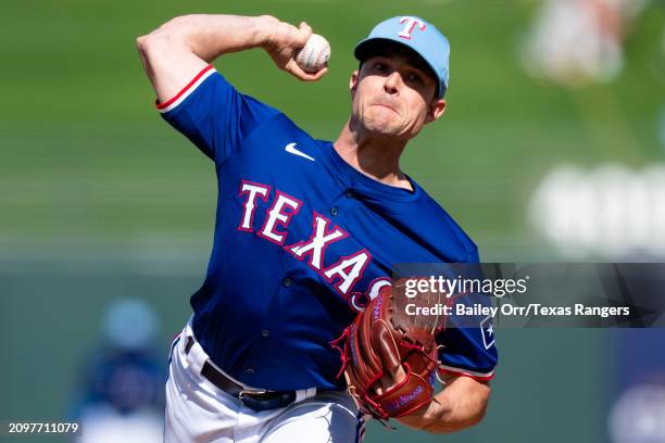 David Robertson of the Texas Rangers pitches during a spring training game against the Kansas City Royals at Surprise Stadium on March 08, 2024 in...