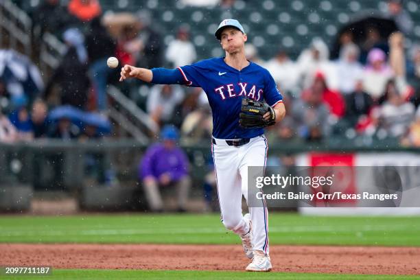 Matt Duffy of the Texas Rangers fields the ball during a spring training game against the Arizona Diamondbacks at Surprise Stadium on March 07, 2024...