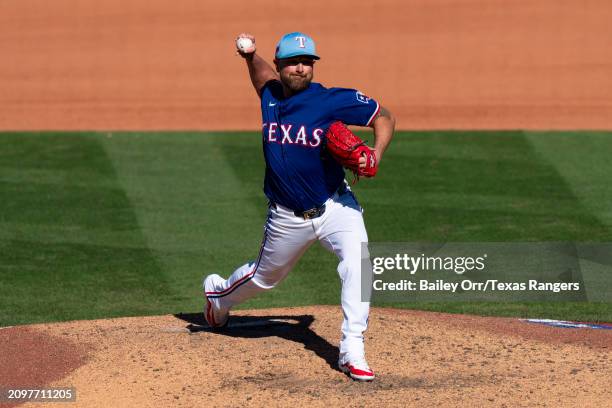 Kirby Yates of the Texas Rangers pitches during a spring training game against the Chicago White Sox at Surprise Stadium on March 02, 2024 in...