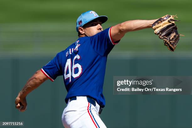 Brock Burke of the Texas Rangers pitches during a spring training game against the Chicago White Sox at Surprise Stadium on March 02, 2024 in...