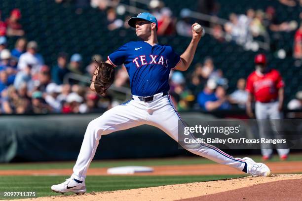 Cody Bradford of the Texas Rangers pitches during a spring training game against the Los Angeles Angels at Surprise Stadium on March 04, 2024 in...