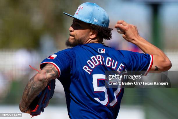 Yerry Rodriguez of the Texas Rangers pitches during a spring training game against the Los Angeles Angels at Surprise Stadium on March 04, 2024 in...