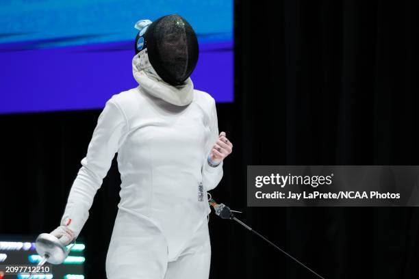 Tierna Oxenreider of the Columbia Lions celebrates scoring a point against Ketki Ketkar of the Cornell Big Red in the semifinal epee competition...