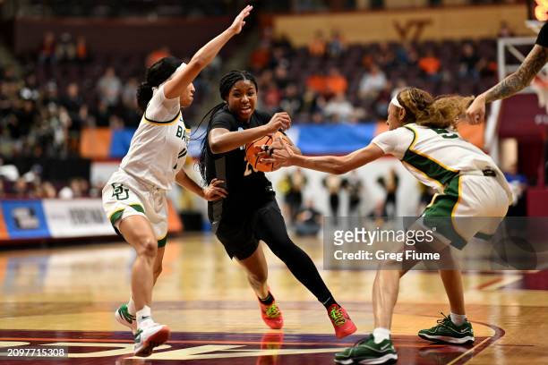 Iyana Moore of the Vanderbilt Commodores fights through the defense of Jada Walker of the Baylor Lady Bears and Darianna Littlepage-Buggs of the...