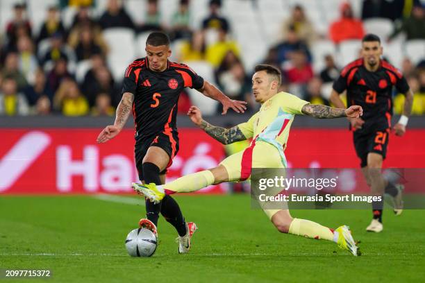 Alejandro Grimaldo of Spain battles for the ball with Kevin Castaño of Colombia during the international friendly match between Spain and Colombia at...