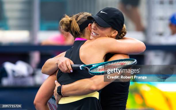 Paula Badosa of Spain and Aryna Sabalenka embrace at the net after the second round on Day 7 of the Miami Open Presented by Itau at Hard Rock Stadium...