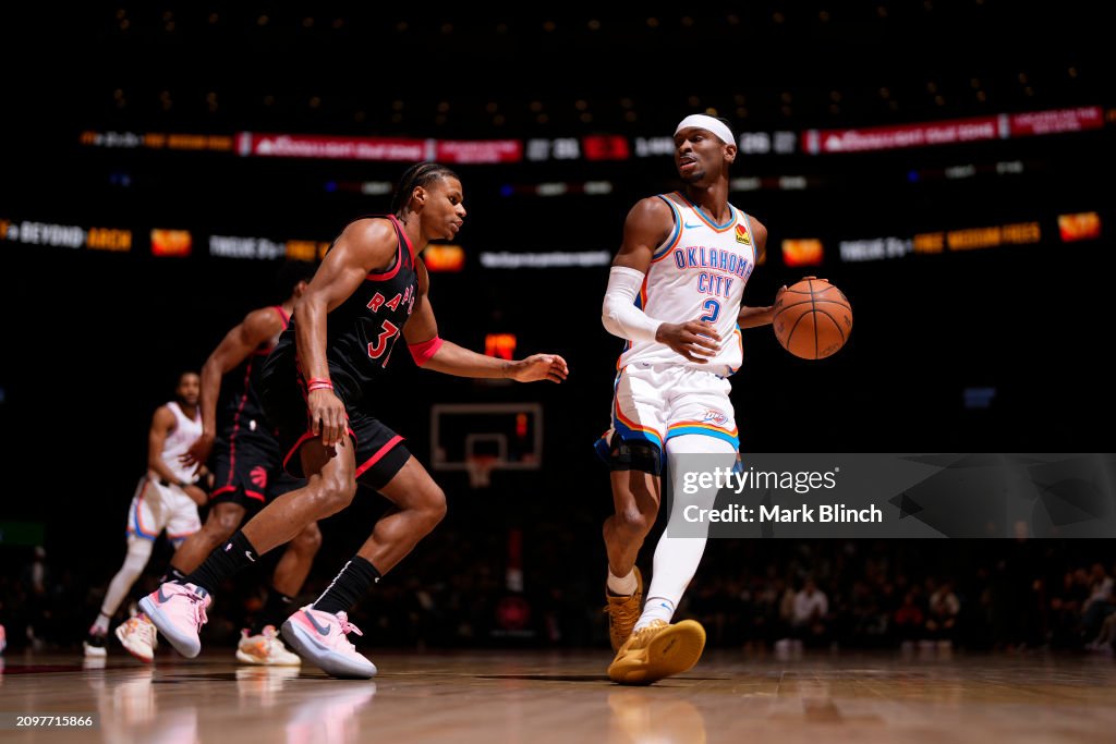 Thunder Raptors Shai Gilgeous-Alexander of the Oklahoma City Thunder handles the ball ...