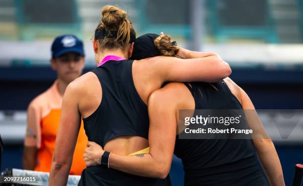 Paula Badosa of Spain and Aryna Sabalenka embrace at the net after the second round on Day 7 of the Miami Open Presented by Itau at Hard Rock Stadium...