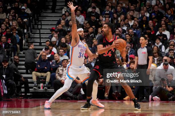 Jontay Porter of the Toronto Raptors handles the ball during the game against the Oklahoma City Thunder on March 22, 2024 at the Scotiabank Arena in...