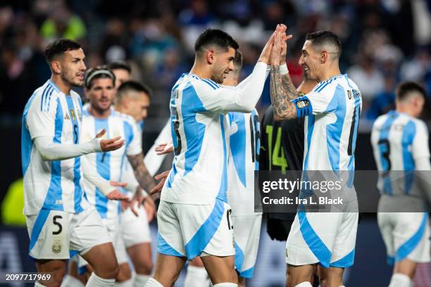 Ángel Di Maria of Argentina celebrates the goal by Cristian Romero of Argentina during the first half of the International Friendly match against El...