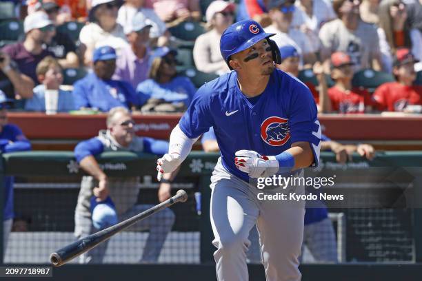 Seiya Suzuki of the Chicago Cubs hits a grand slam in the first inning of a spring training game against the San Francisco Giants in Scottsdale,...