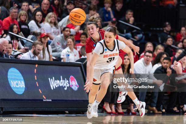 Guard Jamie Loera of the Eastern Washington Eagles knocks the ball out of the hands of guard Martha Pietsch of the Oregon State Beavers during the...