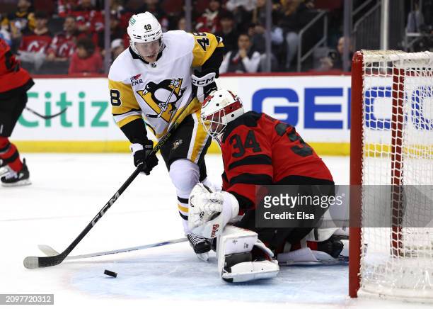 Valtteri Puustinen of the Pittsburgh Penguins is unable to score as Jake Allen of the New Jersey Devils defends during the first period at Prudential...