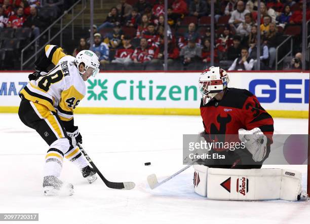 Valtteri Puustinen of the Pittsburgh Penguins is unable to score as Jake Allen of the New Jersey Devils defends during the first period at Prudential...