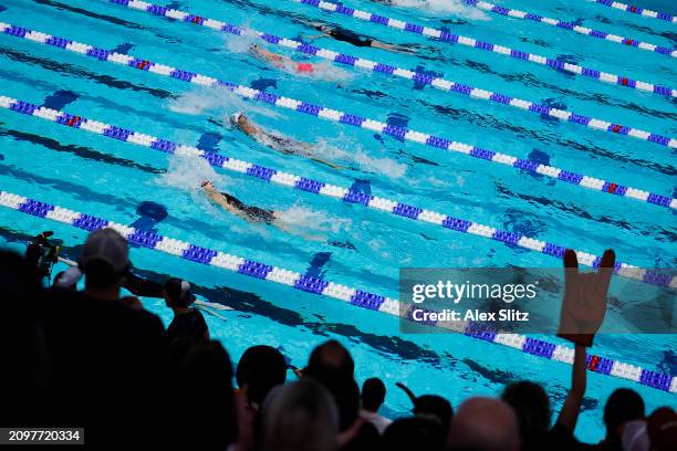 People cheer in the Women's 100 Yard Backstroke consolation finals during the Division I Women's Swimming and Diving Championships held at Ramsey...